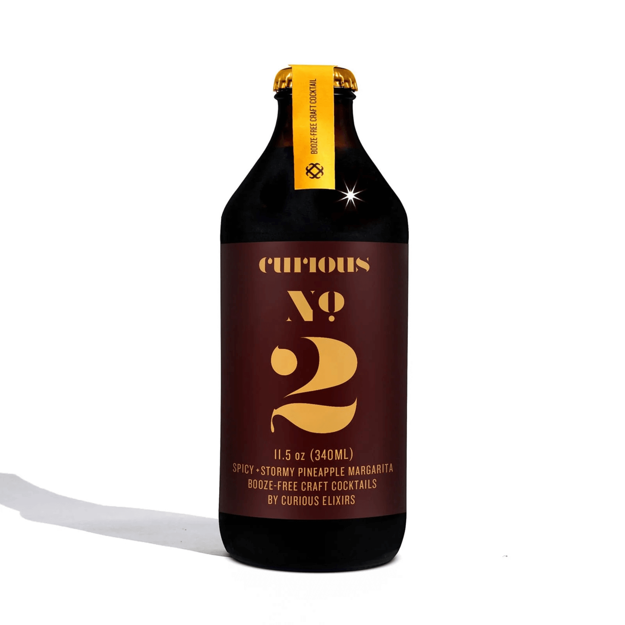 Curious Elixirs No. 2 non-alcoholic spicy margarita, 11.5oz bottle, featuring pineapple, lime, and jalapeño flavors, crafted in USA.