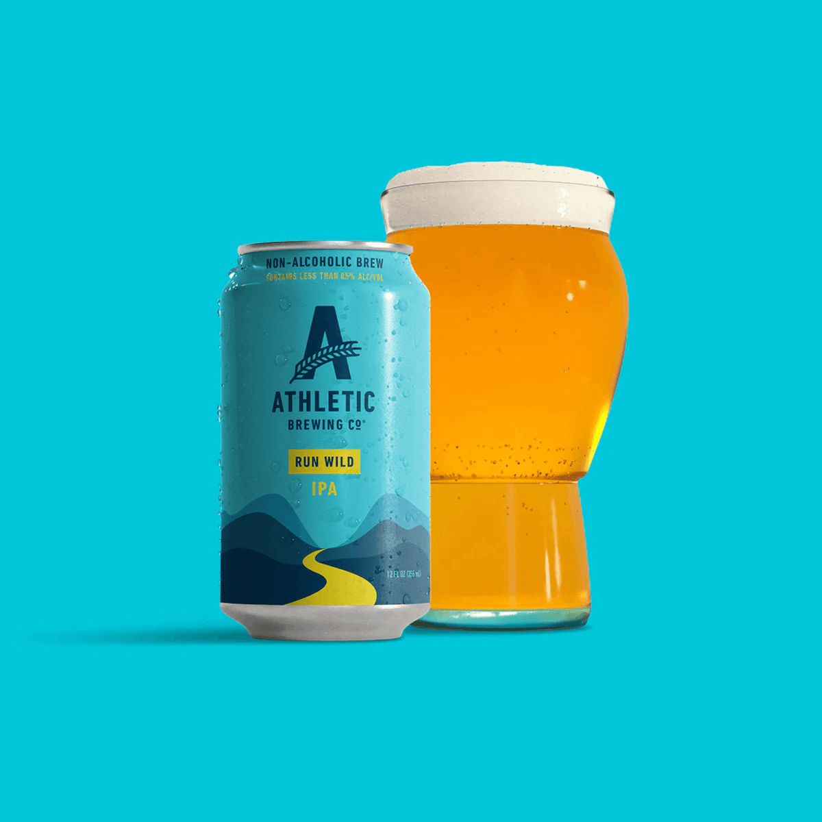 Athletic Brewing Run Wild IPA can and glass of non-alcoholic beer with a vibrant citrus and pine aroma.