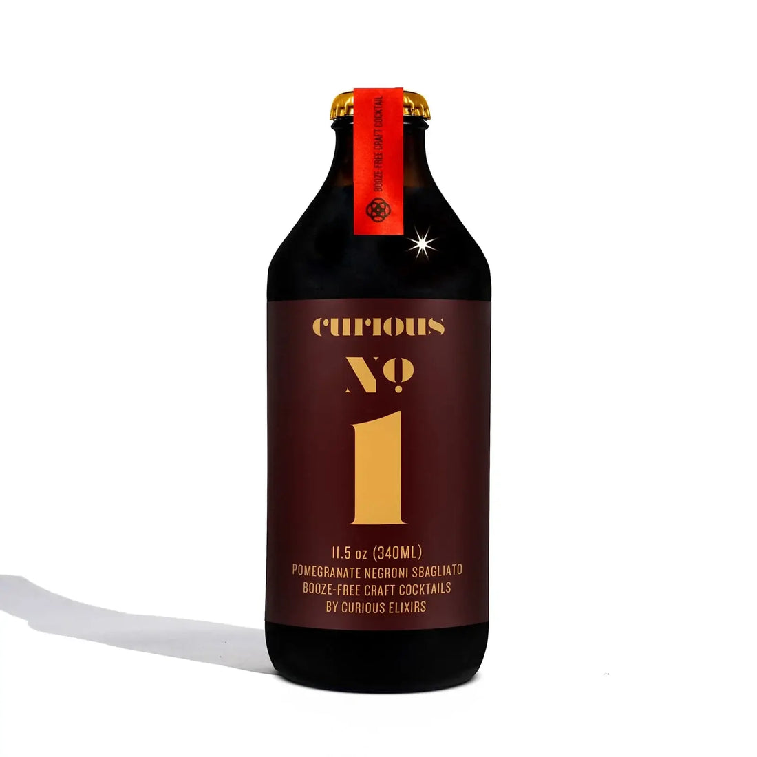 Curious Elixirs No.1 Pomegranate Negroni NA cocktail bottle, 11.5 oz, alcohol-free craft drink.