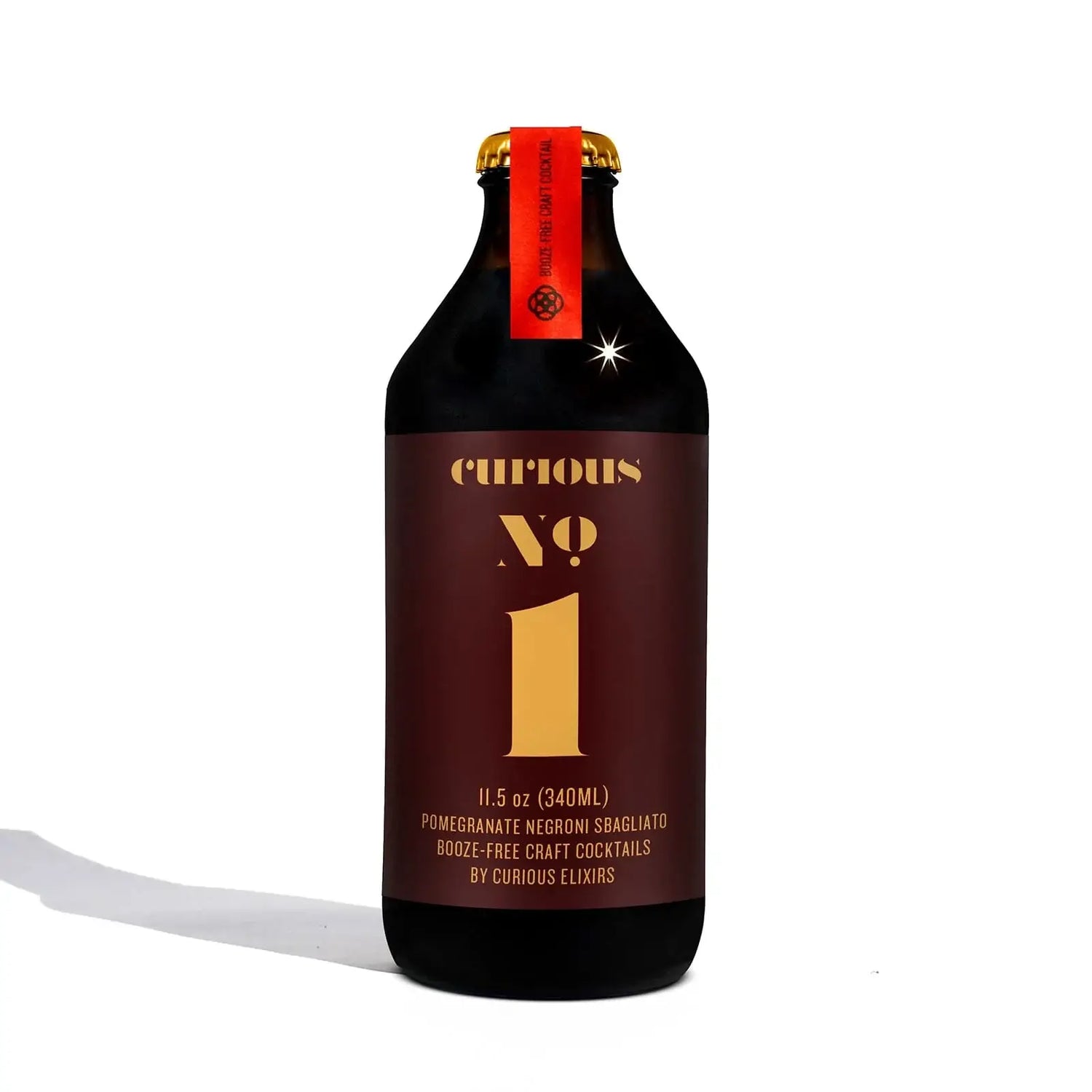 Curious Elixirs No.1 Pomegranate Negroni NA cocktail bottle, 11.5 oz, alcohol-free craft drink.