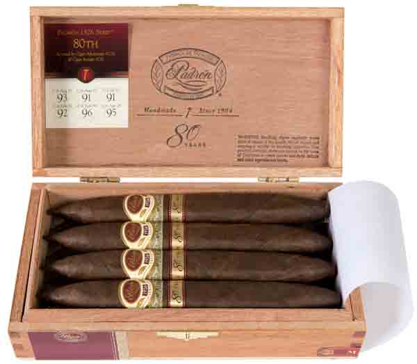 Open wooden box of Padron 1926 80th Natural cigars, displaying eight Nicaraguan cigars with rich wrappers.