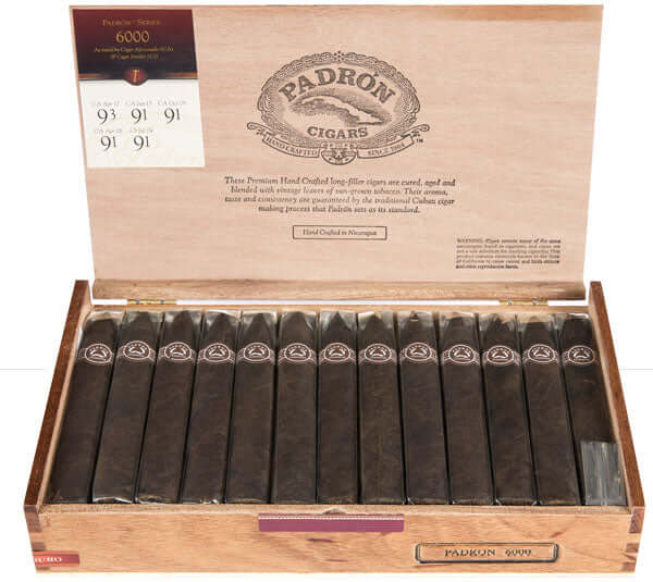 Open box of Padrón 6000 Natural cigars, Nicaraguan origin, medium to full strength, 5 1/2 x 52 size, displaying robust flavors.