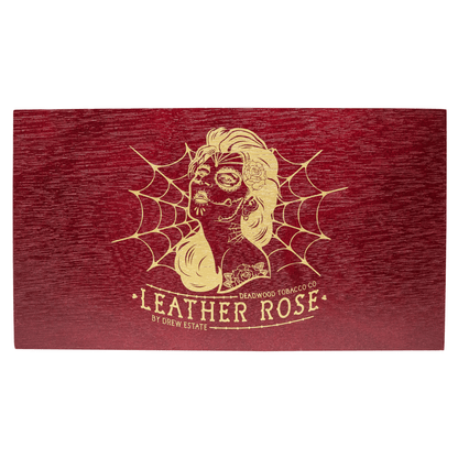 Wooden box of Deadwood Leather Rose Torpedo cigars with artistic design, showcasing bold and spicy flavor from Nicaragua.